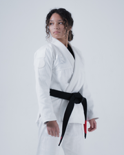 Kingz Born to Rule Women's Jiu Jitsu Gi - White - Three-Quarter View Female Athlete Embroidered Logo Chest Black Belt Contrast Stitching Reinforced Panels Premium Fabric BJJ Gi Training [color:White]