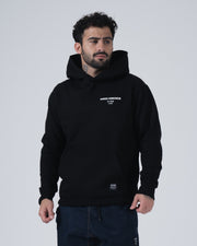 Kingz HQ V2 Hoodie - Front Angled View - White Chest Logo and Hem Label - Black - Men's BJJ Hoodie