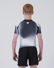 Kingz Galaxy Youth Rashguard Black White - Full Body Straight Back View Teen Boy Athlete Short Sleeve Galaxy Ombre Pattern Gold Crown Logo Centered Upper Back Black Shorts Kids