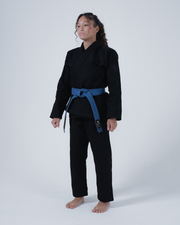 Kingz Born to Rule Women's Jiu Jitsu Gi - Black - Full Body Front View Female Athlete Black Gi Blue Belt Crown Badge Sleeve Minimalist Design BJJ Training Gi [color:Black]