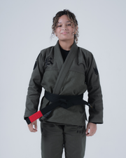 Kingz Born to Rule Women's Jiu Jitsu Gi Military Green - Front View Female Athlete Black Logo Shoulder Embroidered Text Pants Diamond Weave Fabric Durable Construction BJJ Gi Training [color:Military Green]