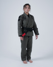 Kingz Born to Rule Women's Jiu Jitsu Gi Military Green - Full Body Front View Female Athlete Black Shoulder Patches Embroidered Chest Logo Black Belt Contrast Stitching Durable Fabric BJJ Gi Training [color:Military Green]