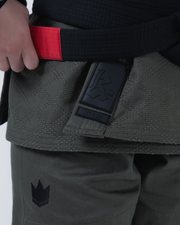 Kingz Born to Rule Women's Jiu Jitsu Gi - Military Green - Close-Up Detail View Black Belt Red Label Kingz Text Black Patch Crown Badge Quilted Texture BJJ Gi Training [color:Military Green]