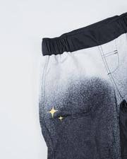Kingz Galaxy Youth Shorts Black White - Close Up Front Panel Detail Gold Star Sparkle Graphics Galaxy Gradient Speckle Texture Back Pocket Waistband Visible Kids Grappling Shorts No-Gi BJJ