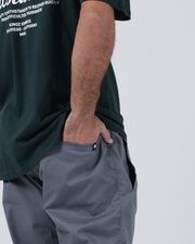 Kingz Casual Rip Stop Gi Pant - Grey - Close-Up Side View Male Athlete Grey Rip Stop Fabric Black Crown Tag BJJ Gi Training Apparel [color:Grey]