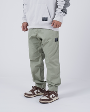 Kingz Casual Rip Stop Gi Pant Stone Green - Front View Male Athlete Sage Green Rip Stop Fabric Black Patch Detail Elastic Cuffs Relaxed Fit BJJ Gi Training Apparel [color:Stone Green]