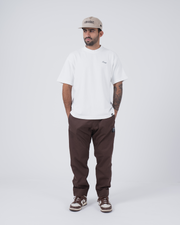 Kingz Casual Rip Stop Gi Pant - Brown - Full Body Front View Male Athlete Earthy Brown Rip Stop Fabric Black Label Right Thigh Relaxed Fit BJJ Gi Training [color:Earthy brown]