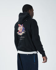 Black BJJ hoodie front view on adult male model showing ribbed cuffs snap collar and kangaroo pocket