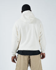 Beige BJJ hoodie back view on adult male model displaying clean rear panel and drawstring hood shape