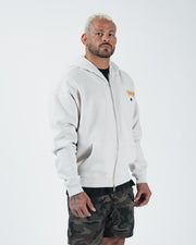 Grey BJJ zip up hoodie side profile view on adult male model showing full zipper and relaxed fit drape