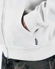 Grey BJJ zip up hoodie pocket detail closeup showing side hand pocket Kingz hem label and ribbed bottom