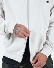 Grey BJJ zip up hoodie cropped front shot with adult male model fastening the front zipper hardware