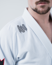 Kingz Ultralight 2.0 BJJ Gi White - Close Up Chest Lapel Detail Three Feathers Embroidered Design Black Thread Pearl Weave Texture