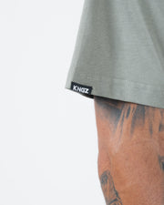 Kingz Kore V2 Tee - Sleeve Label Detail - KINGZ Woven Tag - Mossy Green BJJ Premium Cotton T-Shirt