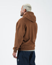 Chestnut brown BJJ hoodie back three-quarter view on adult male model showing clean rear panel and hood