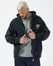 Black BJJ zip up hoodie cropped front shot with adult male model opening zipper worn over grey tee