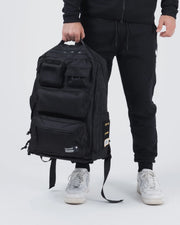 Kingz Tactical Backpack Black - Lifestyle Carry Shot - Held by Handle at Waist - BJJ Tactical Backpack