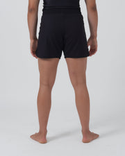 Kingz Kore 2.0 Women's Shorts Black - Full Body Back View Female Athlete Solid Black All-Black Minimal Back Design Side Splits Visible Women's Grappling Shorts No-Gi BJJ Kore Collection [color:Black]