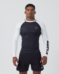 Kingz Ranked Performance V2 L/S Rashguard Navy White - Full Body Front View Male Athlete Long Sleeve Navy Blue Body White Raglan Sleeves White Crown Logo Chest KINGZ White Sleeve Text White Collar Matching Navy Shorts BJJ IBJJF