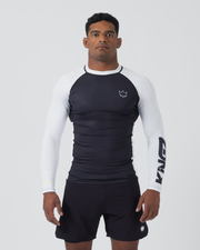 Kingz Ranked Performance V2 L/S Rashguard Navy White - Full Body Front View Male Athlete Long Sleeve Navy Blue Body White Raglan Sleeves White Crown Logo Chest KINGZ White Sleeve Text White Collar Matching Navy Shorts BJJ IBJJF