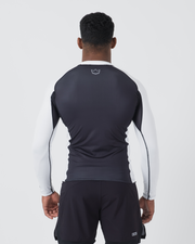 Kingz Ranked Performance V2 L/S Rashguard Navy White - Full Body Straight Back View Male Athlete Long Sleeve Navy Blue Body White Long Sleeves White Crown Logo Upper Back White Side Panels Matching Navy Shorts IBJJF BJJ