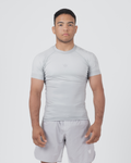 Kingz Ghost Rashguard Silver Gray - Full Body Front View Male Athlete Short Sleeve All Gray Minimal Design Subtle Crown Logo Light Gray Matching Shorts Crown Badge Compression Fit