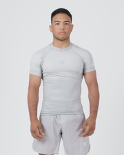 Kingz Ghost Rashguard Silver Gray - Full Body Front View Male Athlete Short Sleeve All Gray Minimal Design Subtle Crown Logo Light Gray Matching Shorts Crown Badge Compression Fit