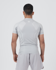 Kingz Ghost Rashguard Silver Gray - Full Body Straight Back View Male Athlete Short Sleeve Crown Logo Subtle Upper Back All Gray Minimal Ghost Design Matching Gray Shorts Clean Aesthetic
