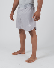 Kingz Ghost Grappling Shorts Silver Gray - Full Body Right Side Profile Male Athlete Light Silver Gray Crown Logo Right Thigh Side Split Visible Minimal Clean Design Men's Grappling Shorts No-Gi BJJ