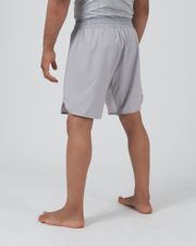 Kingz Ghost Grappling Shorts Silver Gray - Full Body Left-Back Side Profile Male Athlete Light Silver Gray All-Gray Minimal Design Side Split Competition Cut Men's Grappling Shorts No-Gi BJJ