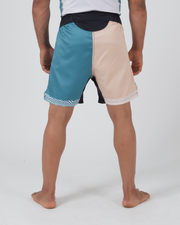Kingz Flow Performance Series Shorts Blue Cream - Full Body Back View Male Athlete Two-Tone Teal Blue Left Half Cream Beige Right Half Wavy Hem Trim Black Waistband Side Panels Competition Cut Men's Grappling Shorts No-Gi BJJ