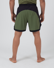 Kingz Trooper Hybrid Shorts Black Olive - Full Body Back View Male Athlete Large Olive Green Back Panel Black Waistband Black Side Panels Black Hem Two-Tone Design Inner Compression Shorts Visible Men's Grappling Shorts No-Gi BJJ