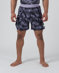 Kingz Viper Hybrid Shorts Black Purple - Full Body Front View Male Athlete Hexagonal Camo Pattern Sublimated Lavender Elastic Waistband Lime Green Crown Logo Right Thigh Competition Cut Men's Grappling No-Gi BJJ