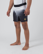Kingz Galaxy Performance Series Shorts Black White - Full Body Right Side Profile Male Athlete Black White Galaxy Fade Gradient Gold Circular Crown Badge Right Thigh Competition Cut Men's Grappling Shorts No-Gi BJJ