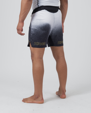Kingz Galaxy Performance Series Shorts Black White - Full Body Back View Male Athlete Galaxy Gradient White Top to Black Bottom KINGZ Gold Text Both Legs Back Side Split Competition Cut Men's Grappling Shorts No-Gi BJJ