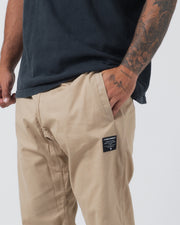 Kingz Casual Rip Stop Gi Pant Khaki - Close-Up Side View Tattooed Male Hand Pocket Black Label Ripstop Fabric BJJ Gi Training Apparel [color:Khaki]