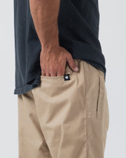 Kingz Casual Rip Stop Gi Pant Khaki - Side View Male Hand in Pocket Black Crown Logo Tag Durable Fabric BJJ Gi Training Apparel [color:Khaki]