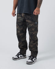 Kingz Casual Rip Stop Gi Pants - Camo - Full Body Front View Male Athlete Dark Camo Pattern Black Label Right Thigh Relaxed Fit BJJ Gi Training [color:Dark/Camo]