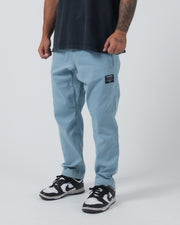Kingz Casual Gi Pant Light Denim - Partial Body Front View Male Athlete Light Denim Color Black Label Right Thigh Relaxed Fit Comfortable BJJ Gi Training Apparel [color:Light Denim]
