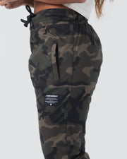 Kingz Casual Rip Stop Gi Pant - Camo - Side View Close-Up Camo Pattern Elastic Waistband Black Drawstring Kingz Logo Patch Left Thigh Durable Fabric BJJ Gi Training Apparel [color:Dark/Camo]