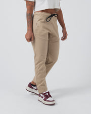 Kingz Casual Rip Stop Pants Khaki - Partial Body Front View Female Model Black Drawstring Elastic Waist Relaxed Fit Side Pockets Lightweight Fabric BJJ Training Casual Wear [color:Khaki]