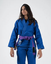 Kingz Classic 3.0 Women's BJJ Gi Blue - Upper Body Front View Female Athlete Purple Belt Crown Badge Logo KINGZ Label Women's