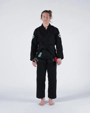 Kingz Classic 3.0 Women's BJJ Gi Black - Full Body Front View Female Athlete Black Belt Teal Crown Badge Logos Women's Cut