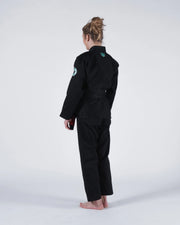 Kingz Classic 3.0 Women's BJJ Gi Black - Full Body 3/4 Back View Female Athlete Black Belt Teal Crown Badge Logo Back Sleeve