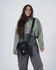 Kingz Side Bag Black - Lifestyle Shot - Worn as Crossbody at Hip Level - BJJ Athlete Carrying Bag