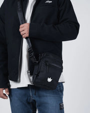 Kingz Side Bag Black - Torso Lifestyle Shot - Side Bag Held at Hip - Compact BJJ Crossbody Training Bag