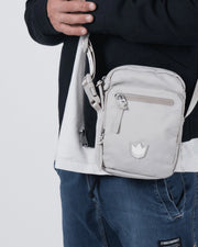 Kingz Side Bag Cream - Torso Close-Up Male Lifestyle - Cream Crossbody Crown Logo BJJ Training Bag