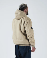 Kingz Canvas Jacket Desert - Back View Male Model Hooded Design Black Sleeve Patch Relaxed Fit Ribbed Hem Streetwear [color:Desert]