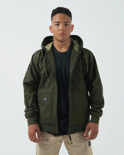 Kingz Canvas Jacket Military Green - Front View Male Model Hooded Design Black KINGZ Chest Logo Dual Front Pockets Ribbed Cuffs Streetwear Style Casual Apparel [color:Black]