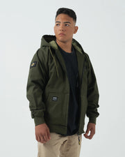 Kingz Canvas Jacket Military Green - Front View Male Model Hooded Design Black Chest Patch Crown Badge Left Sleeve Streetwear Casual Apparel [color:Black]